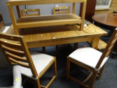 A GOOD MODERN PINE EXTENDING DINING TABLE AND FOUR CHAIRS