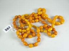 AMBER two strands of butterscotch amber beads, one graduated and 70cms long and the (darker) of