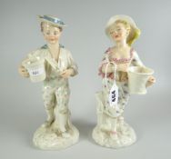 A PAIR OF ROYAL WORCESTER FIGURES believed by JAMES HADLEY in the form of a gardening boy holding