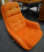 A 1960s / 1970s SWEDFURN-TYPE SWIVEL ARMCHAIR in flecked orange cotton upholstery on chrome