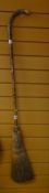 AN INTERESTING CURLING BROOM with silver rim inscribed 'To Miss M Macgregor from Fern and Locheyre