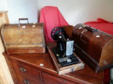 A COLLECTION OF THREE VINTAGE CASED SINGER SEWING MACHINES