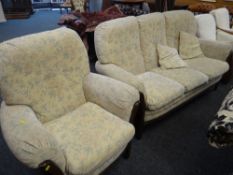 MID C20TH SPLAT-BACKED THREE SEATER SETTEE AND MATCHING ARMCHAIR (2) with floral upholstery
