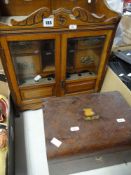 A WALL MOUNTING SMOKERS' CABINET, together with a walnut and mother of pearl writing box
