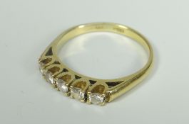 18CT YELLOW GOLD FIVE STONE DIAMOND RING. Total diamond weight 0.30ct (visual estimate), 4.7 grams