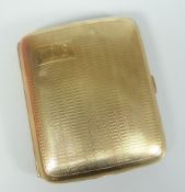 9CT YELLOW GOLD ENGINE TURNED CURVED CIGARETTE CASE WITH MONOGRAM. 73 grams approximately. Condition