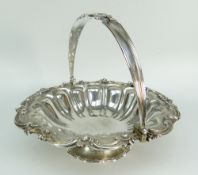 WILLIAM IV SILVER FLUTED SWING HANDLED PEDESTAL BOWL having scroll, foliate and floral border.