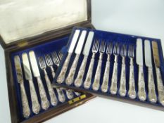 CASED TWELVE-PIECE DESSERT KNIFE & FORK SET having silver handles with scroll and shell