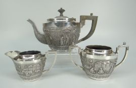 AN INDIAN STERLING SILVER THREE-PIECE TEASET comprising teapot, sucrier and cream jug, overall