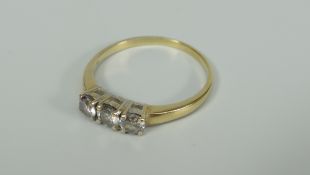 18K YELLOW GOLD THREE STONE DIAMOND RING. Total diamond weight 0.45 ct (visual estimate), 3.2