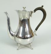 EDWARD VII SILVER POT BELLIED COFFEE POT RAISED ON FOUR SPLAY FEET with wooden handle and flower