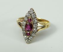 18CT YELLOW GOLD DIAMOND AND RUBY MARQUISE CLUSTER RING. 4 grams approximately. Condition Report: In
