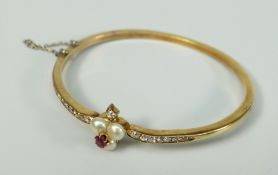 YELLOW METAL DIAMOND, RUBY AND PEARL BANGLE the stones arranged depicting the playing suit of '