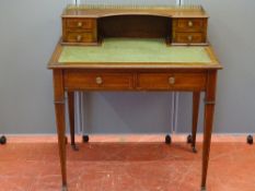 AN EDWARDIAN INLAID MAHOGANY LADY'S WRITING DESK with brass galleried four drawer top section and