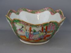 A 19th CENTURY CANTON CHINESE FAMILLE VERT DECORATED BOWL, the lobed edge with continual floral