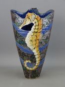 A ROGER COCKRAM PIERCED STONEWARE SEAHORSE VASE, 24 cms high with seal stamps in relief and