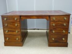 A CIRCA 1900 TWIN PEDESTAL DESK with excellent blood red tooled leather effect top, 145 cms wide, 82