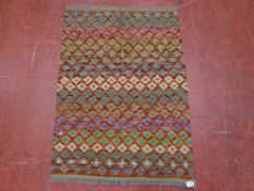 A VEGETABLE DYE WOOL CHOBI KELIM OPEN BORDERED RUG with repeating double line pattern, 120 x 85 cms