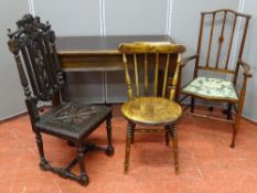 AN EDWARDIAN MAHOGANY RECTANGULAR TOPPED TABLE with rexine insert, a carved oak hall chair, a