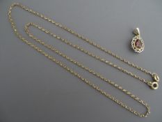 A NINE CARAT GOLD SMALL LINK NECK CHAIN, 2.7 grms and a nine carat gold pear shaped pendant with