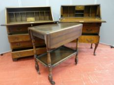 A RUSTIC STYLE BUREAU, a walnut effect bureau and a polished tea trolley