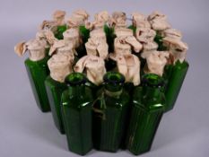 APOTHECARY BOTTLES - Thirty one green glass hexagonal ribbed bottles, most with original paper