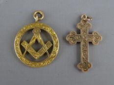 A NINE CARAT GOLD MASONIC PENDANT FOB and a chased decorated nine carat gold cross, 7.2 grms gross