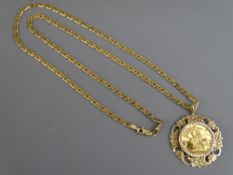 A GOLD FULL SOVEREIGN, 1979 in a fancy nine carat gold mount on a 60 cms nine carat gold link
