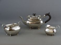 A THREE PIECE SILVER TEASET comprising teapot, sugar basin and milk jug, simple plain form with