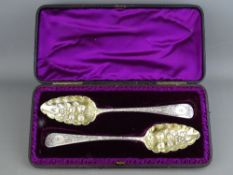 A PAIR OF GEORGE III SERVING SPOONS, London 1803 by Thomas Wallis II, the gilt bowls with berry