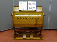 R F STEVENS MODEL 25 PORTABLE ORGAN, a compact and quirky model with folding legs for