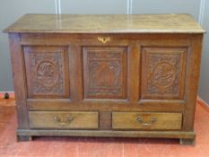 AN EARLY 19th CENTURY OAK MULE CHEST, the lift-up lid with iron strap hinges and working lock with