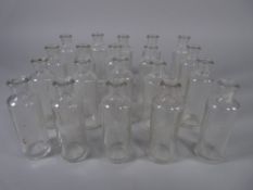 APOTHECARY BOTTLES - Twenty clear glass tincture bottles marked 'Teaspoons', 9 cms high