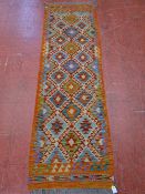 A VEGETABLE DYE WOOL CHOBI KELIM CARPET RUNNER, vibrant colours with wave border and multi-diamond