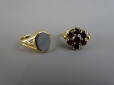 A FIFTEEN CARAT GOLD GARNET CLUSTER DRESS RING, 3.3 grms, size 'M' and a nine carat gold signet