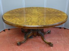 AN ANTIQUE BURR WALNUT OVAL TILT TOP BREAKFAST TABLE on bulbous support and four scrolled feet