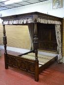 AN EXCELLENT REPRODUCTION OAK FULL TESTER BED FRAME with full height carved panel back and arched