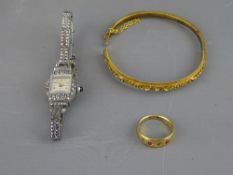 AN EIGHTEEN CARAT GOLD RING, 4.3 grms, size 'N', a Victorian wirework decorated bangle stamped '