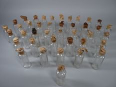 APOTHECARY BOTTLES - Forty clear glass tincture bottles marked 'Teaspoons' and with original paper