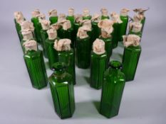 APOTHECARY BOTTLES - Thirty one green glass hexagonal ribbed bottles, most with original paper