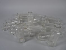 APOTHECARY BOTTLES - Twenty clear glass tincture bottles marked 'Teaspoons', 9 cms high