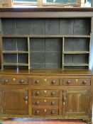 A 19th CENTURY OAK & PINE DRESSER having an open upper rack and three over three 'T' arrangement
