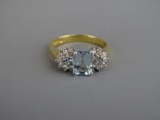 AN EIGHTEEN CARAT GOLD STAMPED 750 UNTESTED AQUAMARINE & DIAMOND DRESS RING, 8 x 5 mm central stone,