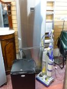 A silver finished Zanussi upright fridge freezer, a black IceQ bar top fridge and a Dyson DC03