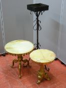 Two onyx and brass circular topped side tables, 35 and 43 cms diameter and a wrought iron planter