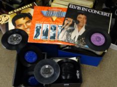 A collection of vintage LP and 45rpm records, artists include Chuck Berry, Nat King Cole, Dean