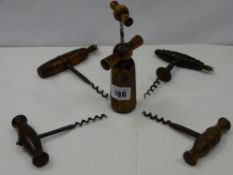 Five vintage and antique wooden handled corkscrews