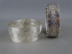 A Victorian silver and probably gold mounted bangle, Birmingham hallmark and a Chester marked, chase