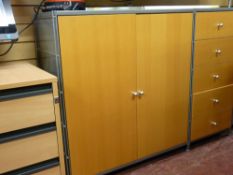 An ultra modern metal and light wood storage system, similar good home office furniture and a