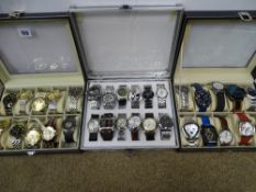 Approximately thirty modern mainly gent's fashion watches, in apparently as new condition